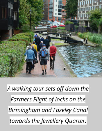 A walking tour sets off down the Farmers Flight of locks on the Birmingham and Fazeley Canal towards the Jewellery Quarter.